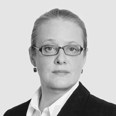 A black and white photo of a woman wearing glasses