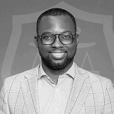 A black and white photo of a man in a suit